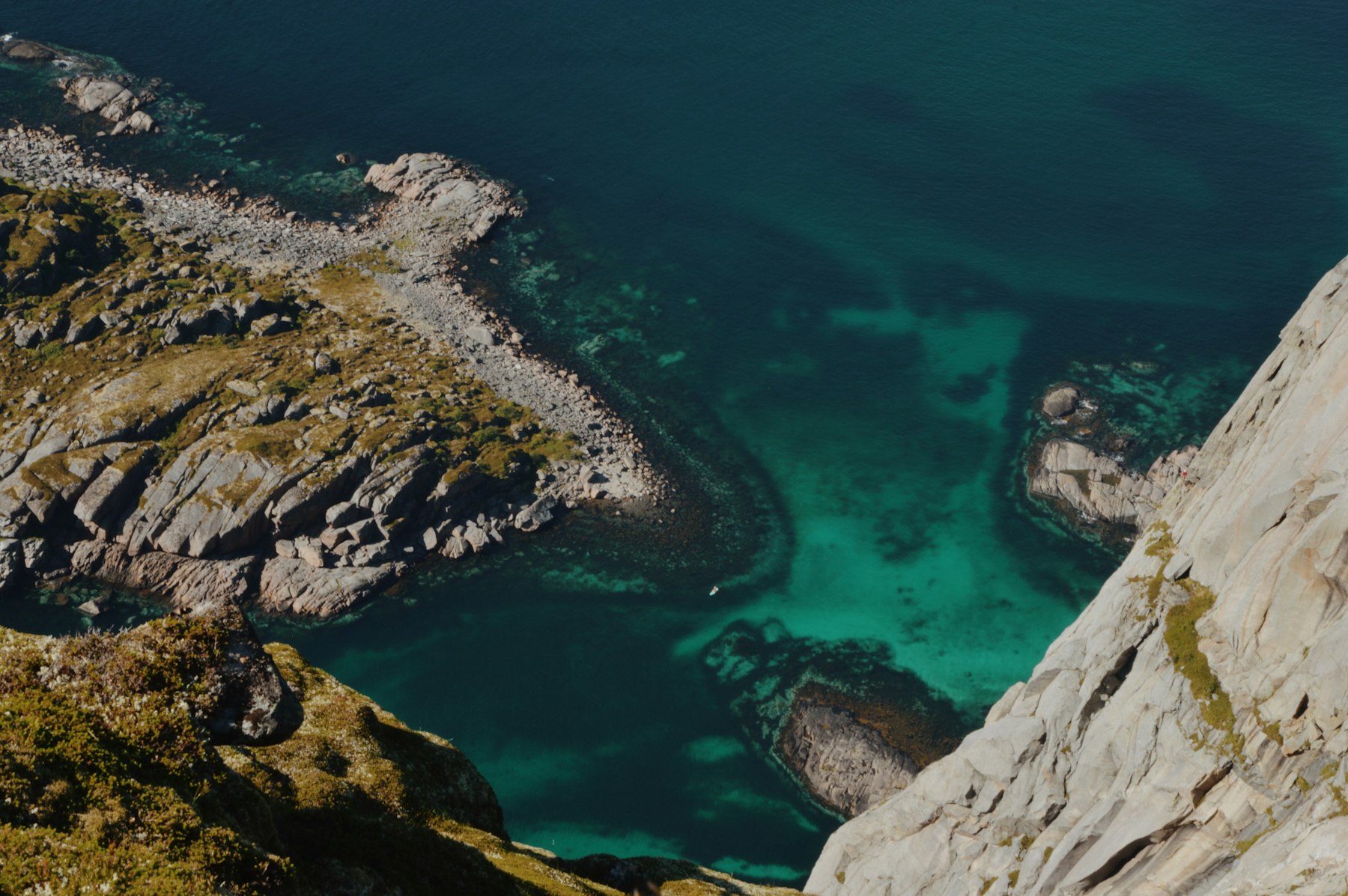 Turquoise water and granite cliffs in Lofoten