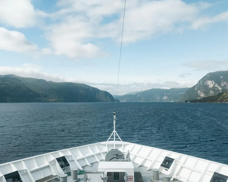 The bow of a coastal ship heading into the fjords